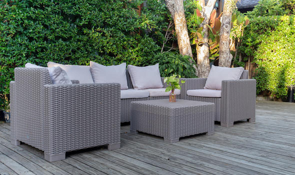 large-terrace-patio-with-rattan-garden-furniture-in-the-garden-on-wooden-floor.jpeg